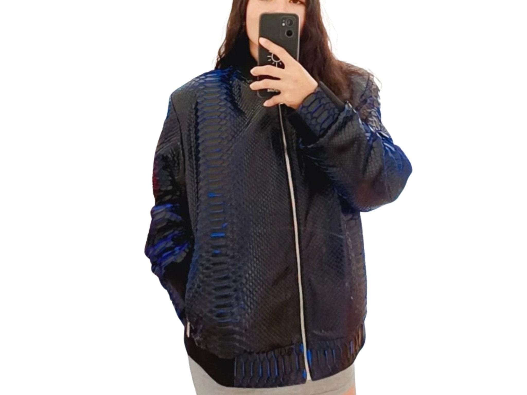 Snakeskin bomber jacket with dark blue scale texture, front zip, and ribbed waistband