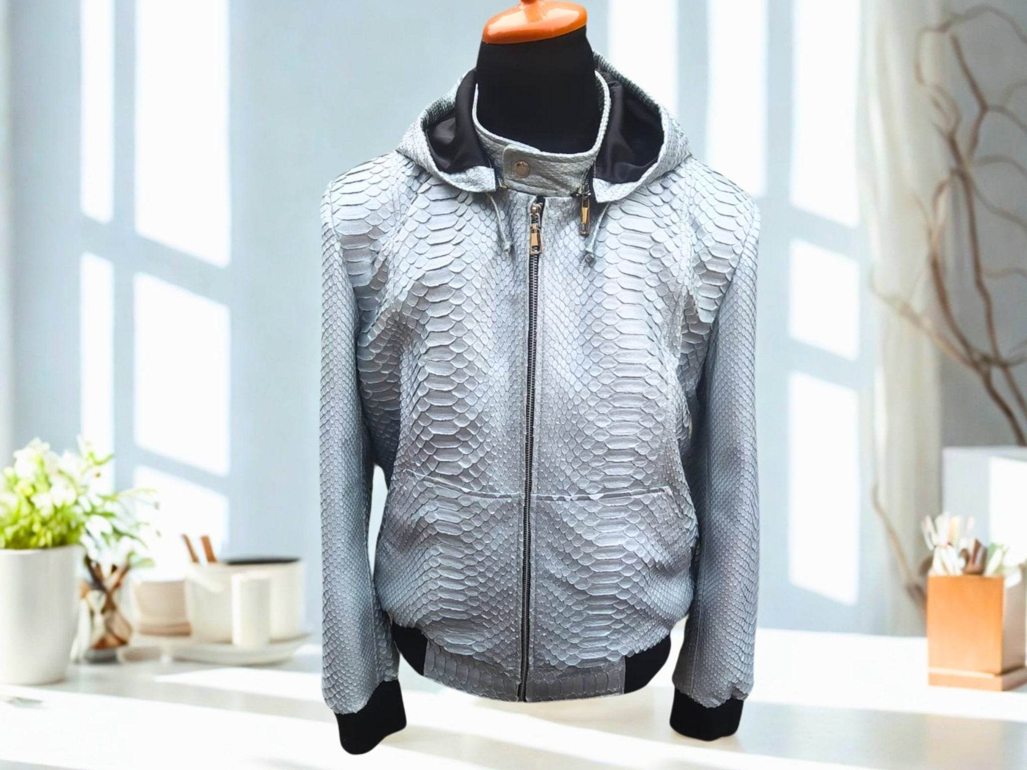 Light blue snakeskin-pattern zip-up hoodie jacket with dark hood lining and cuffs.