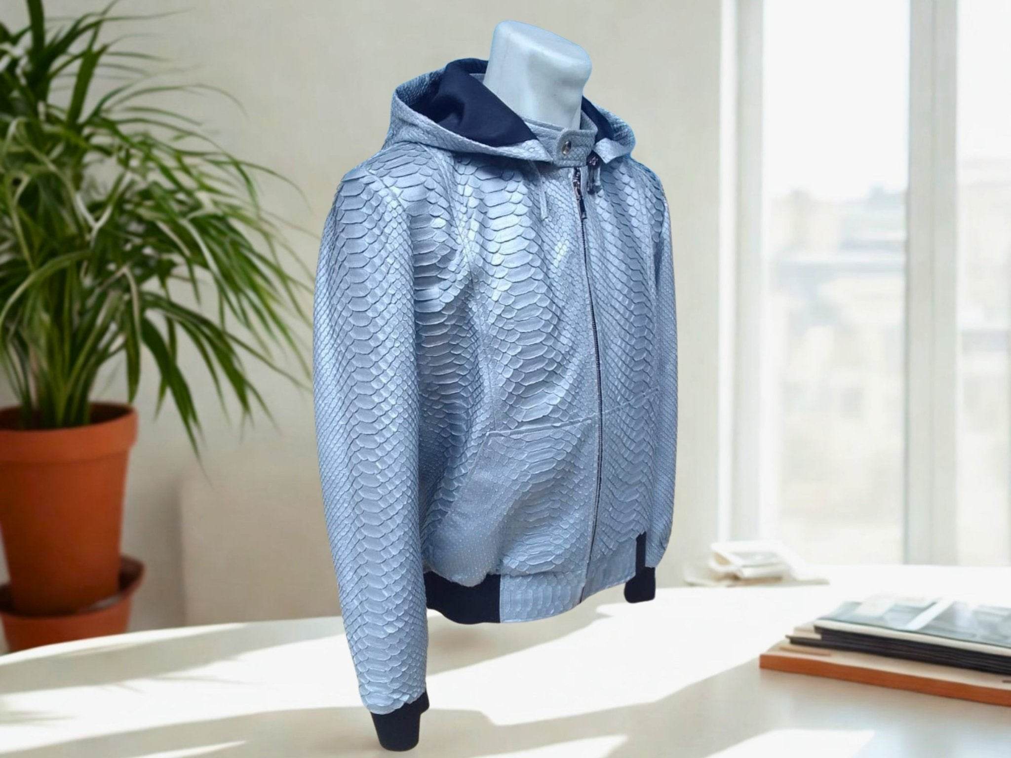 Light blue snakeskin-pattern hoodie jacket, front view with full zipper and hood.