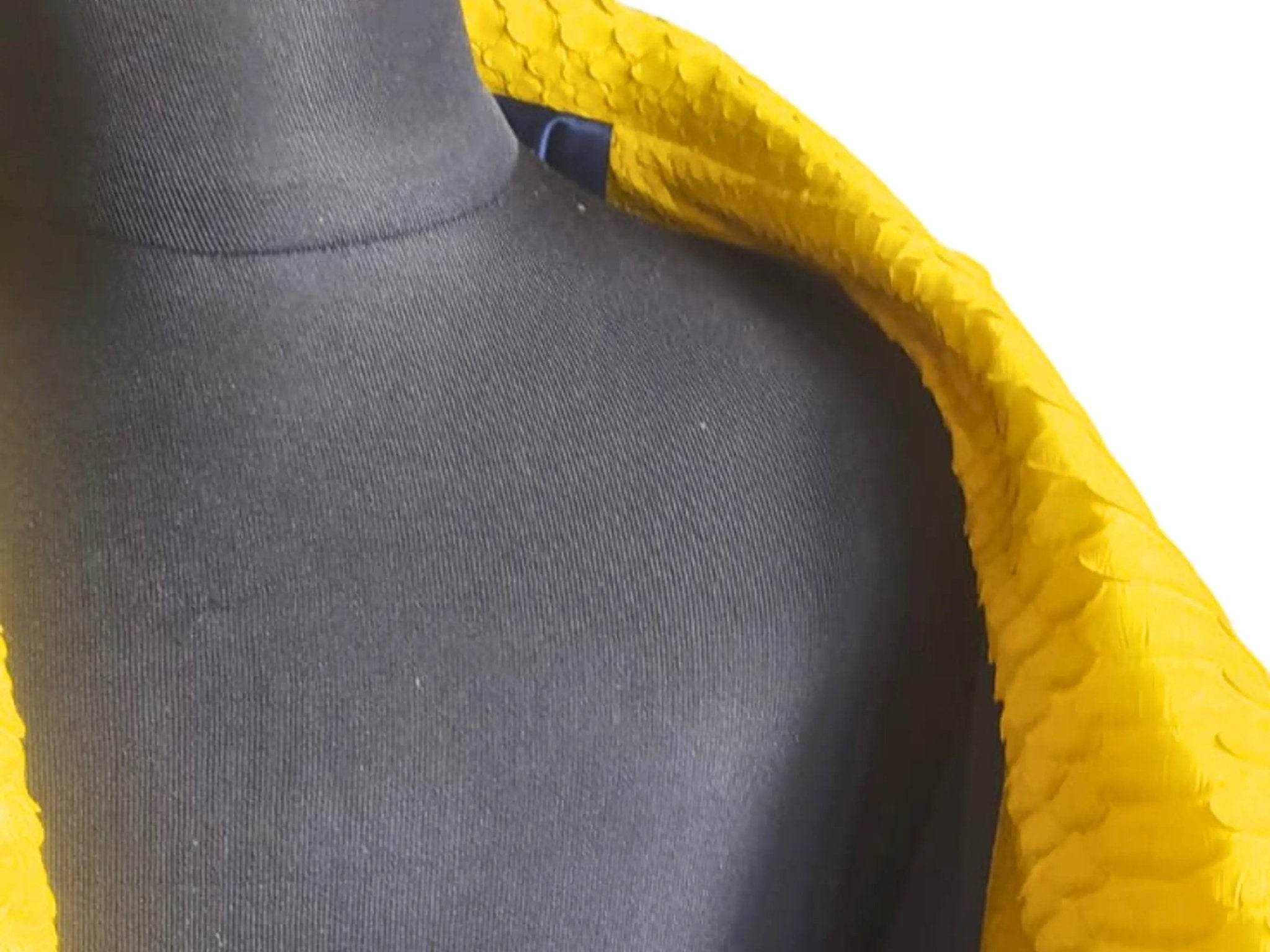 Yellow snakeskin-texture jacket neckline close-up with inner lining visible