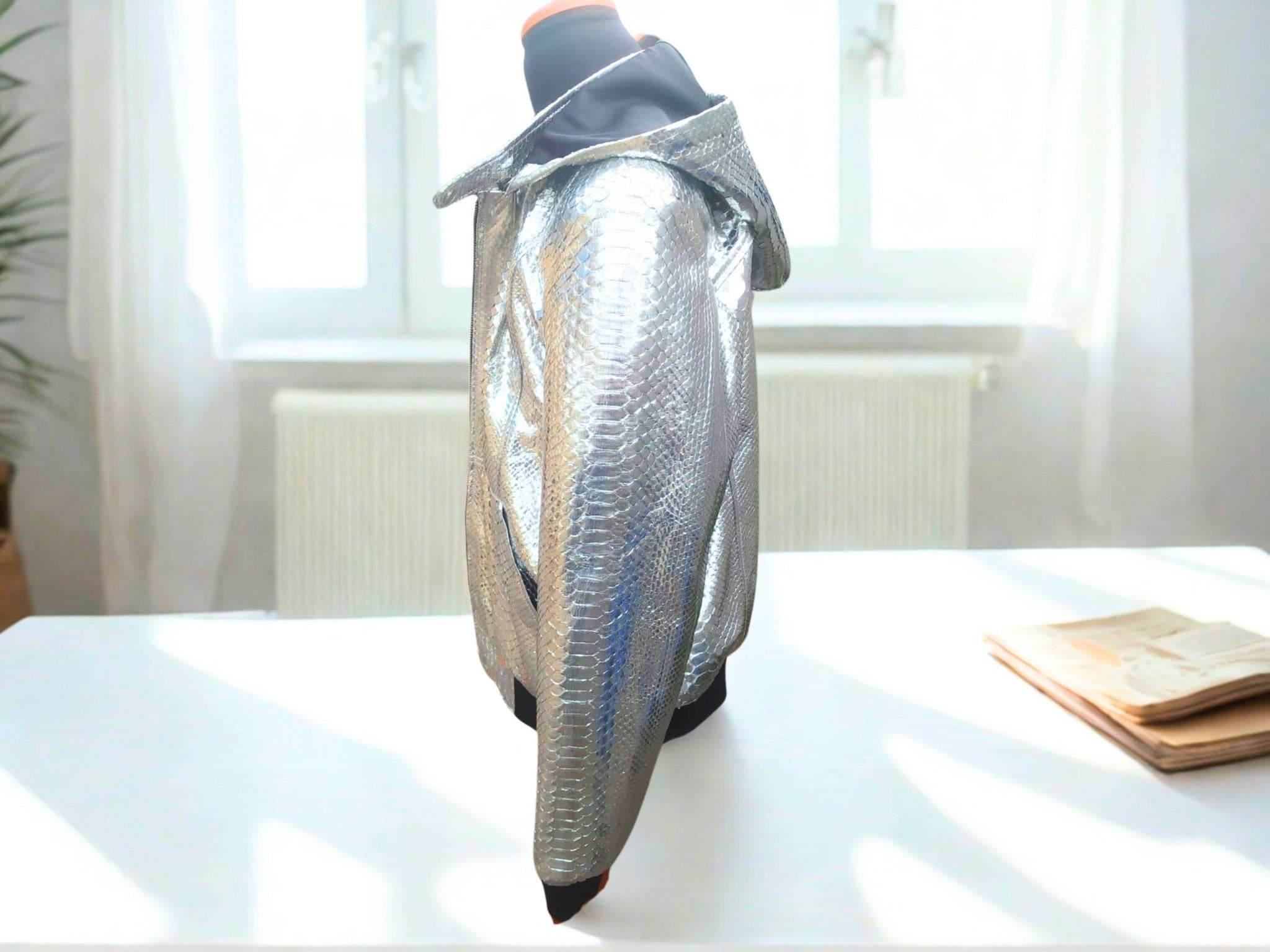 Snakeskin-style hooded leather jacket, silver textured finish with black cuffs and hem