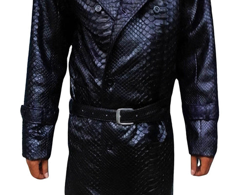 Snakeskin trench coat detail: dark blue patterned fabric, button collar, and waist belt.