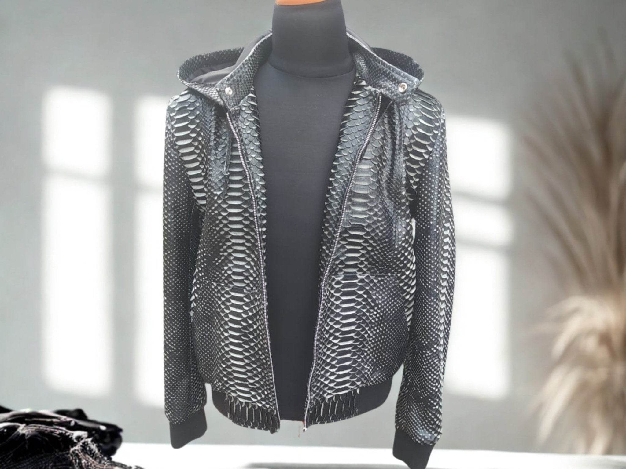 Snakeskin leather varsity jacket with deep V neckline and front zipper, hood removed.