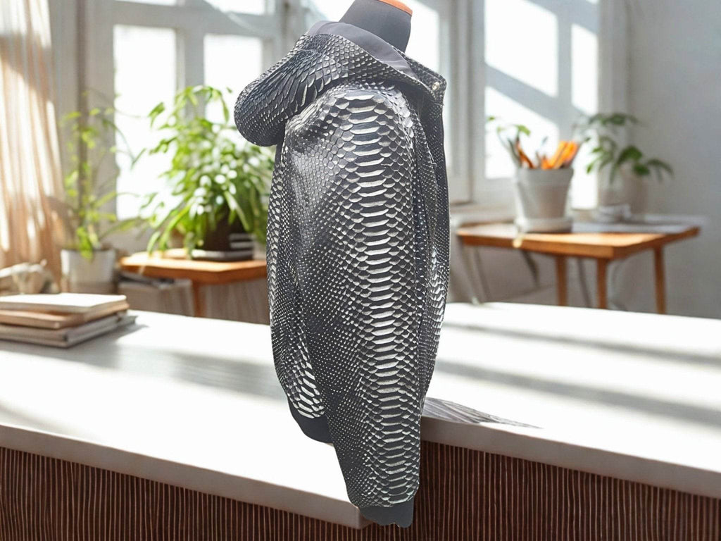 Metallic snakeskin leather jacket with stand collar and front zipper, side view.