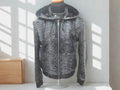 Snakeskin leather varsity jacket with stand collar and front zipper, no hood attached.